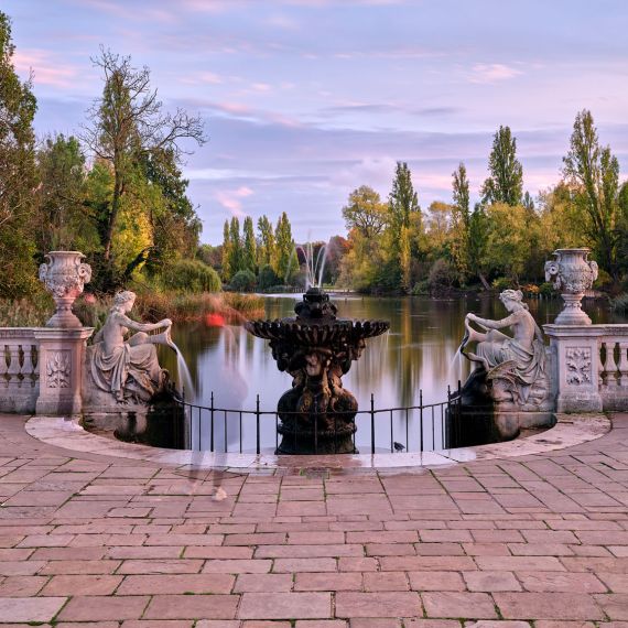 A landscape photograph of the Italian fountains in Kensington Gardens, London from Andrew's series of long-exposure landscape photographs. The four-minute exposure renders the water in a soft flow, and the people become "ghosts" passing through the scene. Limited edition fine art prints of this photo are available up to 72 inches in width and framed in wood, metal or acrylic styles.