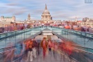 A conceptual photograph capturing the flow of pedestrians in motion crossing London's Millennium Bridge. The composition incorporates numerous high-definition images, each one captured using long exposure times. The individual images are then seamlessly merged into a single large-scale composition. Limited edition prints of this photo are available up to 80 inches in width.