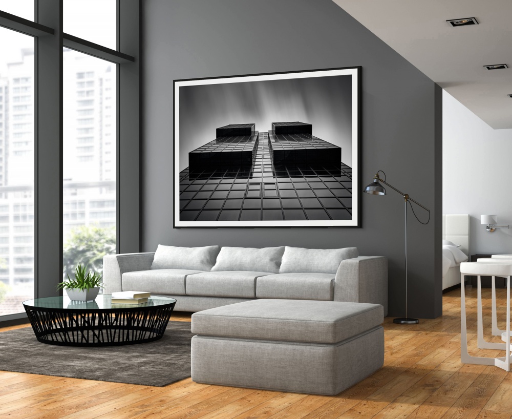 A large-scale framed black and white architectural print from London by photographer Andrew Prokos, seen in a luxury home.