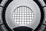 A black and white fine art photo of the Fulton Transit Center interior in New York City captured from levels below. Limited edition fine art prints of this photo are available up to 80 inches in height.