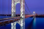 A long-exposure architectural photo of the George Washington Bridge at dusk, New York City