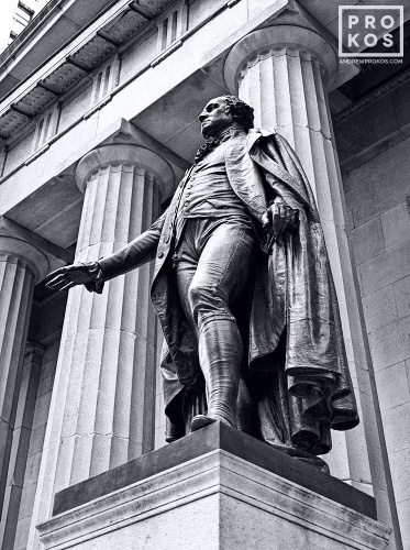 A black and white fine art photo of the bronze statue of George Washington at Federal Hall on Wall Street, New York City