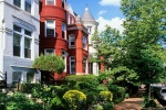 A photo of the historic rowhouses along Georgetown's P Street in summer, Washington DC. Fine art prints of this photo are available framed in various styles. 