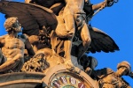 A fine art architectural photo of the Mercury clock on the facade of Grand Central Station at dusk, New York City