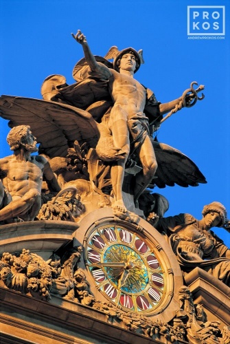 A fine art architectural photo of the Mercury clock on the facade of Grand Central Station at dusk, New York City