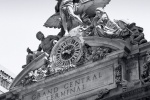 A fine art architectural photograph of Grand Central Station's facade and Mercury Clock in black and white, New York City