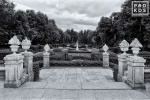 A black and white landscape photo of the balcony overlooking the gardens of the Royal Palace at La Granja de San Ildefonso, Spain. Framed fine art prints of this photo are available in various sizes.