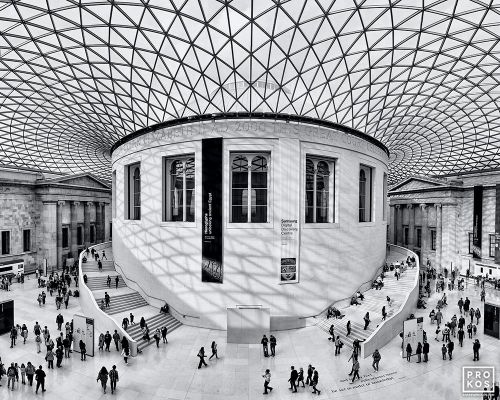 A black and white photograph of the interior of the Great Court in the British Museum, with its contemporary mesh canopy, London, United Kingdom. Limited edition fine art prints of this photo are available up to 72 inches in width.