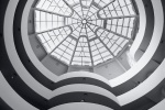 A fine art architectural photograph of the Guggenheim Museum rotunda in black and white, New York City
