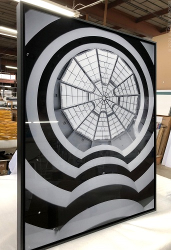 A large-scale black and white limited edition photo of 'Guggenheim Museum Interior V' by photographer Andrew Prokos in production for a new collector. The archival print is mounted on dibond and set in a black solid wood box frame.