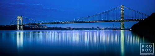 A panoramic photo of the entire span of the George Washington Bridge at night, New York City
