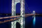 A long-exposure photo of the George Washington Bridge at night, New York City.
