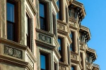 An architectural fine art photo of ornate tenement facades along Washington Street in Hoboken, New Jersey