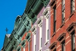 A row of tenement building facades along Washington Street in Hoboken, New Jersey