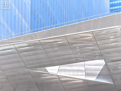 A fine art architectural photo showing interplay of contemporary facades in glass and polished metal from Hudson Yards, Manhattan, NYC . Large-scale framed prints of this photo are available up to 80 inches in width.