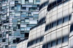 A view of the contemporary facades of the IAC Building and 100 11th Avenue by architects Frank Gehry and Jean Nouvel, in West Chelsea, Manhattan, New York City