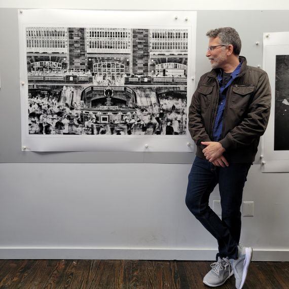 Photographer Andrew Prokos with a 50 inch limited edition print of 'Inverted Grand Central'