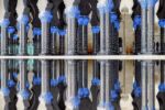 A fine art photograph of the colonnade at Sheikh Zayed Grand Mosque, reflected in a pool at night from Andrew's conceptual photography series "Inverted UAE". Framed limited edition prints of this photo are available up to 72 inches in width