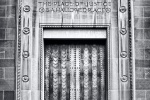 A black and white fine art architectural photo of the Art Deco doors at the United States Department of Justice building, Washington DC