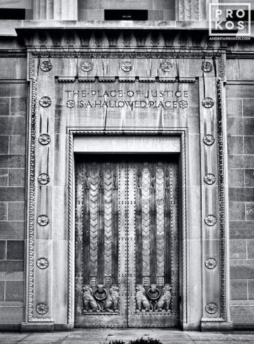 A black and white fine art architectural photo of the Art Deco doors at the United States Department of Justice building, Washington DC