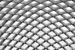 An architectural detail from the undulating glass and steel canopy by Foster + Partners at Kogod Courtyard, located between the National Portrait Gallery and the Smithsonian Museum of American Art, Washington DC. Framed fine art prints of this photo are available up to 80 inches in width. 