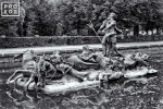 A photo of the statue of Neptune with horse chariot in the gardens at La Granja de San Ildefonso, Spain in black and white. Framed fine art prints of this photo are available in various sizes.