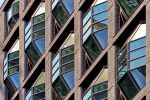 A close-up view of the Lantern House building facade in the High Line neighborhood of Manhattan, with its unique design of emergent bay windows. Limited edition prints of this photo are available up to 80 inches in height.