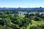 A panoramic landscape photo of the National Mall, Lincoln Memorial and Arlington Memorial Bridge in Washington DC.