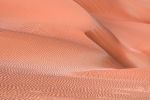 A large-format landscape photograph of a rosy-hued sand dune from the Liwa desert in the Arabian peninsula captured at dusk, Abu Dhabi, UAE. Large-format prints of this photo are available up to 72 inches.