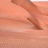 A large-format landscape photograph of a rosy-hued sand dune from the Liwa desert in the Arabian peninsula captured at dusk, Abu Dhabi, UAE. Large-format prints of this photo are available up to 72 inches.