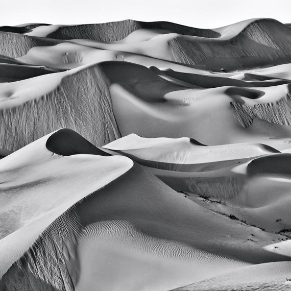 A high-resolution landscape of the dunes of Liwa Desert, Abu Dhabi, United Arab Emirates. Large-format black and white prints of this photo are available up to 90 inches in width.