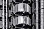 A black and white close-up view of the exposed stainless steel exterior of the iconic Lloyd's Building in London by architect Richard Rogers. Limited edition black and white prints of this photo are available up to 72 inches in width and framed in wood, metal, and acrylic styles.