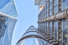 An upward-looking view of the Lloyd's Building and adjacent Willis towers in the City of London during the day, United Kingdom. Limited edition prints of this photo are available up to 72 inches in height.