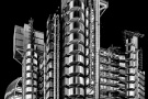 A black and white view of the Modernist Lloyd's Building in the City of London as seen at night, United Kingdom. Limited edition fine art prints of this photo are available up to 72 inches in height and framed in various wood, metal, and acrylic styles. 