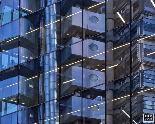 An abstract photograph of City of London building reflections on a black glass facade in tones of blue, black, and grey. Large-format limited edition prints of this photo are available up to 72 inches in width.