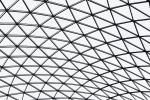 A black and white architectural detail of the mesh canopy covering the British Museum's Great Court in London, United Kingdom. Limited edition prints of this photo are available up to 72 inches in height.