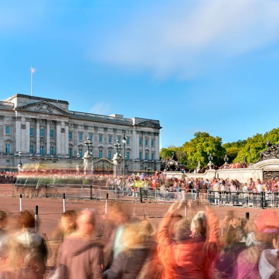 A long-exposure view of Buckingham Palace thronged with spectators watching the procession of the King's Life Guard in London, England, United Kingdom.