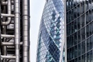 A view of the contrasting facades of modern towers in the City of London as seen during the day, including 30 St. Mary Axe (the Gherkin), the Lloyd's building, and Willis Towers. High-definition fine art prints of this photograph are available up to 72 inches in height.