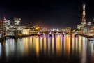 High-Definition Photo by Andrew ProkosHigh-definition fine art photography of the London skyline at night, including the towers of the City of London at left, The Shard at right, and Southwark Bridge and Tower Bridge in the center. Large-format fine art prints of this photo are available up to 120 inches in width.