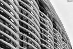 A black and white close-up architectural photo of the curved facade of The Walbrook building in London, England, United Kingdom by photographer Andrew Prokos. Architect: Foster + Partners