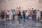 A long-exposure view of visitors viewing the Elgin Marbles at the British Museum, London, United Kingdom. The composition incorporates multiple long-exposure images seamlessly merged into a single pho