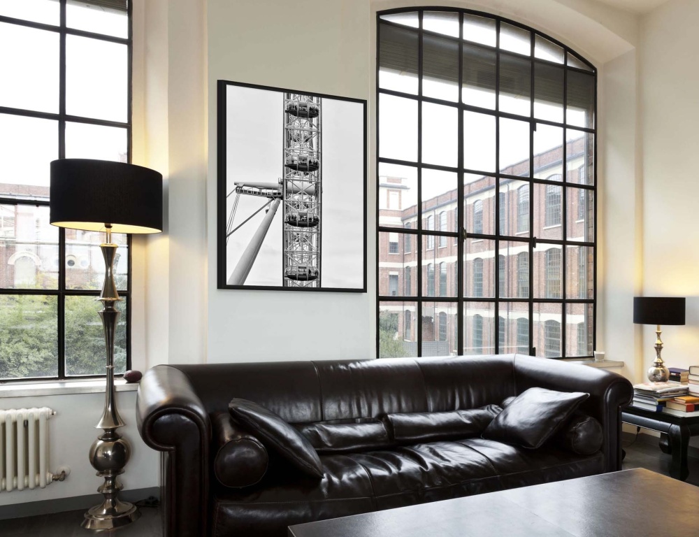 A black and white framed architectural photo of the London Eye as seen in an upscale home interior. Fine art prints of this photo are available up to 72 inches and framed in contemporary styles. 