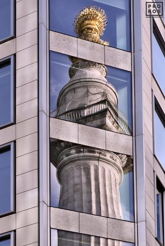 A reflection of the Monument to the Great Fire of London on an adjacent office tower facade, London, United Kingdom. Fine art prints of this photo are available up to 72 inches in height and framed in various wood, metal and acrylic styles.