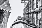 An upward-looking view of the Lloyd's Building and adjacent Willis towers in the City of London, United Kingdom. Limited edition black and white prints of this photo are available up to 72 inches in height.