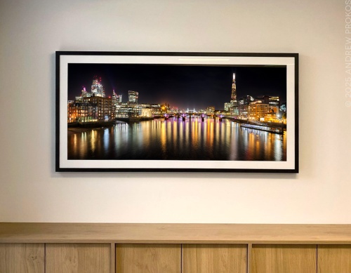 A fifty inch framed fine art print of Panoramic Skyline of London and the Shard at Night by photographer Andrew Prokos