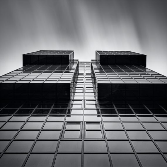 A black and white photo of the facade of the Northern & Shell Building in London, United Kingdom captured in a four minute long exposure by photographer Andrew Prokos. High-definition fine art prints of this photo are available up to 60 inches in width.
