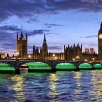 London Eye and Houses of Parliament at Night - Cityscape Photo by Andrew  Prokos