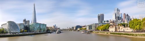 A sweeping panoramic skyline of London, England, during the day in color. Including the skyscrapers of the City of London, The Shard, City Hall and the Tower of London