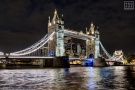 A view of the Tower Bridge and Thames River at night, London, United Kingdom. Large-format fine art prints of this photo are available up to 80 inches in width.