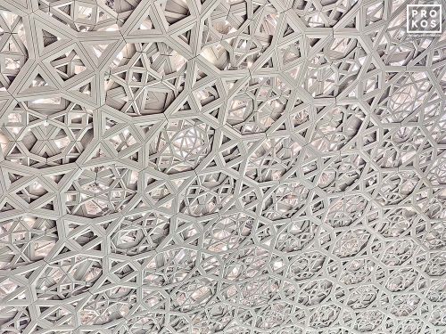 An ultra high-definition photo of the intricate geometric patterns found in the dome interior at the Louvre Museum by architect Jean Nouvel, in Abu Dhabi, United Arab Emirates.